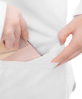Person inserting phone into patch pocket of Straight Up Crisp White Lab Coat For Nurses And Docs Featuring Hella Comfortable Tagless Fit.