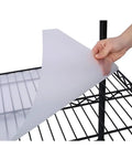 Durable protective mat being placed on the Legit Heavy Duty Wire Shelving Unit Featuring 2450 Pound Load Capacity for organization.