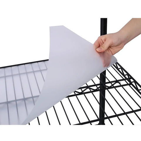 Durable protective mat being placed on the Legit Heavy Duty Wire Shelving Unit Featuring 2450 Pound Load Capacity for organization.