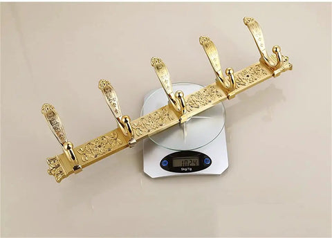 Sleek European Style Golden Coat Hook For Bathroom And Entryway Built Tough Wall Hanging Clothes Rail With Smooth Carved Details Premium Wall Mount and Real Deal Storage Setup on a scale.