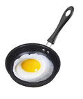 Fried egg in a 4.7 Inch Mini Nonstick Egg Pan For One Egg Frying Perfect Omelets And Pancakes On The Go Portable Camp Kitchen Pan For Gas And Induction Stoves With Ergonomic Handle Black