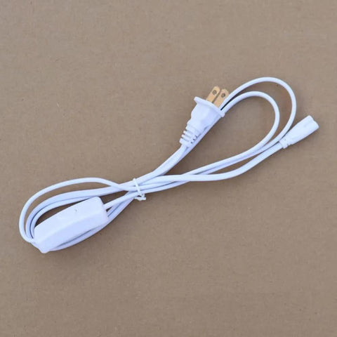 Two Pack T5 T8 Grow Light Power Cord With On Off Switch Five Foot US Plug Extension Cable lying on a brown surface