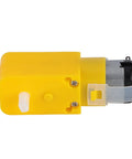 Side view of yellow Mecanum wheel module for geared motor; yellow gearbox housing with white drive shaft and attached motor.