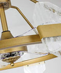 Modern Iron Ceiling Fan With Built In Led Light Combo Featuring Slick Nordic Lines Hella Smooth Variable Speed Options And Rich Coffee Blades For A Top Tier Living Room Setup close-up of gold ceiling fan with crystal accents and motor.