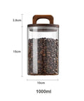 Premium Glass Coffee Canister With An Airtight Wooden Lid, 1000ml capacity, filled with coffee beans, measuring 15cm tall.