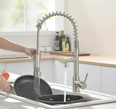 Kitchen Faucet with Pull Down Sprayer, Commercial Spring Single Handle Stainless Steel Sink Faucet in action at a kitchen sink.