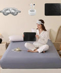 Woman on bed with Grounding Fitted Sheets With 25 Percent Silver Infused Fiber And Cotton, Ultra Conductive Bed Sheets With Grounding Cord, Includes Silver Eye Mask And Grounding Mouse Pad, Day And Night Wellness Kit For Rest, Focus, And Balance