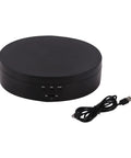 Motorized Rotating Display Stand With Electric Turntable For Products Photography Display Jewelry Watch 3D Models Cake Collectibles Featuring Manual Speed Adjustment And Multiple Angular Views In Sleek Matte Finish, round black USB powered turntable with buttons.
