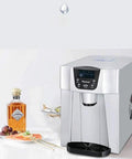 Zero Drama Automatic Countertop Ice Machine Cranking Out Fresh Clear Cubes At Nine Point Five Kilograms Daily With Food Grade Abs Body And Sleek Brushed Metal Finish For Instant Home Bar Ready Vibes on kitchen counter.