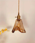 Pendant Light Amber Wavy Glass Shade Vintage Brass Hanging Lamp E26 Adjustable Cable Ceiling Fixture, showcased with floral decor.