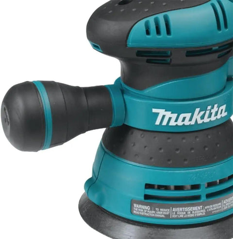 Close-up of a 5 Inch Random Orbital Sander With 3.0 Amp Motor, Variable Speed From 4,000 To 12,000 OPM, Ergonomic Rubberized Palm Grip.