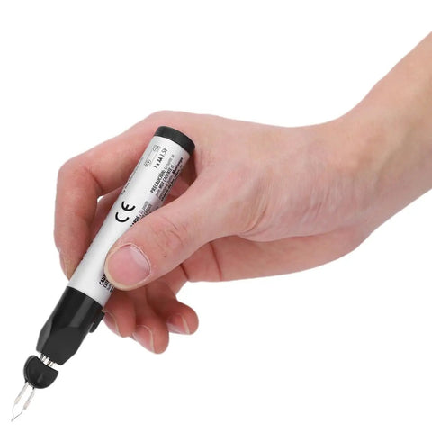 Hand holding the Dang Handy Tungsten Thread Burner Craft Pen for trimming frayed ends, featuring a fast heating tip and ergonomic grip.