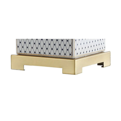 Close-up of the brass gold base of 21.5 Inch White And Navy Ceramic Ginger Jar LED Table Lamp With Fishnet Chinoiserie Pattern