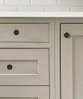 Matte Black Round Cabinet Knobs Ten Pack One And One Fifth Inch Lead Free Safe Drawer Pulls on kitchen cabinets.