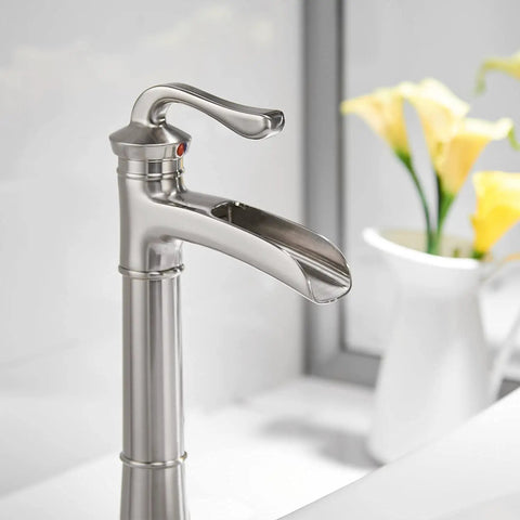Vessel Sink Faucet With Waterfall Style In Brushed Nickel, Tall Farmhouse Style Bathroom Faucet, side view near flowers