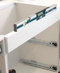 GIM 60 24 Inch Digital Level with Illuminated Rotating Display on white cabinet for angle readings
