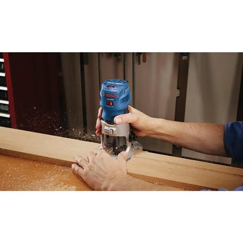 Person using Colt 1.25 HP Variable Speed Palm Router With 7 Amp Motor Precision Handheld Router for woodworking detail work.