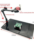 Adjustable Hot Air Gun Stand With Hands Free Holder For BGA Rework And PCB Desoldering Durable Aluminum Clamp Fits Up To 55mm displayed on a black base with measurements.