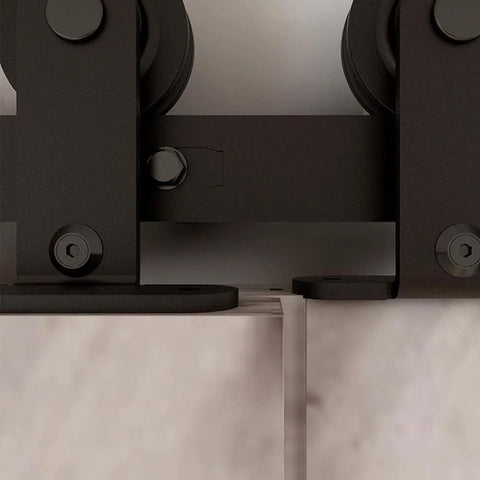 Close-up of 5.5 Foot Bypass Barn Door Hardware Kit For 33 Inch Double Doors, showing T shape hangers on steel rail with nylon rollers.