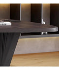 Rock Solid Adjustable Sit Stand Desk With Integrated Charging Outlets And Sculpted Wave Base, close-up view of stylish edge and wave base.