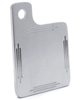 Chrome metal license plate tag back side with top-left mounting hole and grooved lines.