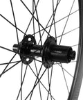 Center lock hub on Carbon Disc Wheelset 50C-25 Clincher With Center Lock 12x100 Thru Axle, showcasing aerodynamic spokes.