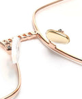 Close-up of gold metal glasses frame with a soft silicone airbag nose pad, part of Super Comfy Silicone Airbag Glasses Nose Pads.