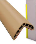 Close-up of brown Rubber Wall Corner Guards 16.4ft Self Adhesive L Molding Edge Protectors on table and wall corner
