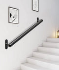 Hardcore 16 Inch Wall Mount Metal Handrail For Stairs Rock Steady Non Slip Safety Grab Bar For Elderly Indoor Outdoor Steel Support Railing With No Sweat Setup Black mounted on a wall beside stairs.