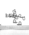 316 Stainless Steel D Shackle Mini Shackles For Paracord Jewelry And Bracelet Hardware Built Tough Marine Grade Rigging 1 Eighth Inch Pin Opening Durable Pack Of 10 For Survival Gear And Craft Projects with ruler for scale.