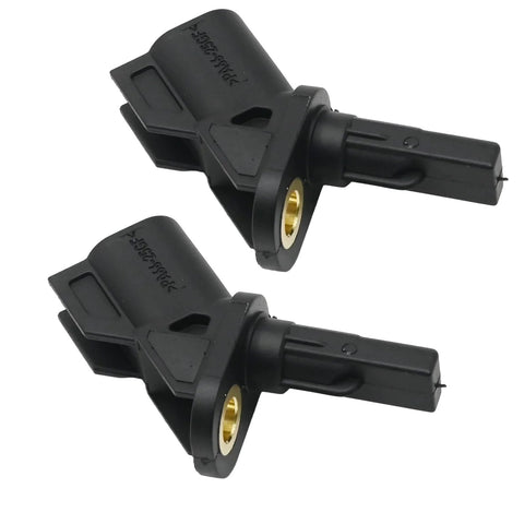 Pair of black plastic front ABS wheel speed sensors with brass mounting bushings.