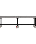 Industrial Mobile Welding Table With Precision Laser Cut Grid And Smooth Locking Casters For Easy Shop Rolling, side view with red casters.