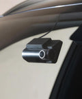 Road-Ready Dual Front And Rear True 4K Dash Cam with STARVIS 2 Sensor mounted on car windshield, close-up view