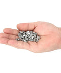 Heavy Duty 6.5mm Tire Stud Inserts 100 Piece Anti Slip Kit For Cars Trucks And Atvs in a hand, showing titanium steel clips for winter traction.