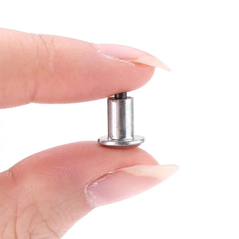 Heavy Duty Tungsten Steel Tire Stud Screws 100 Piece Set shown being held in hand for easy installation on winter tires.
