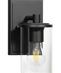 Farmhouse 4 Light Matte Black Bathroom Vanity Light With Clear Tubular Glass Shades Over Mirror Wall Fixture Dope Industrial Vibe Hardwired Up Or Down Mount For Bath And Bedroom close-up on a single light.