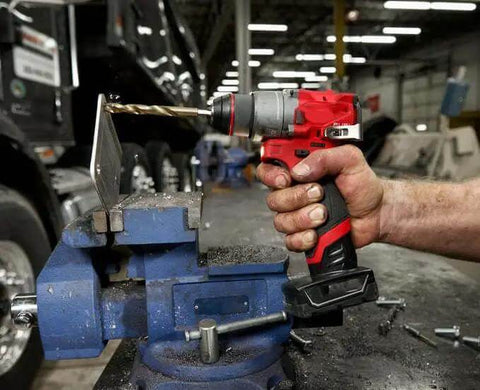 Compact 12V Cordless Drill Driver Kit With Brushless Motor And Heavy Grip Chuck Compatible With Milwaukee M12 Fuel Models drilling metal in vice.