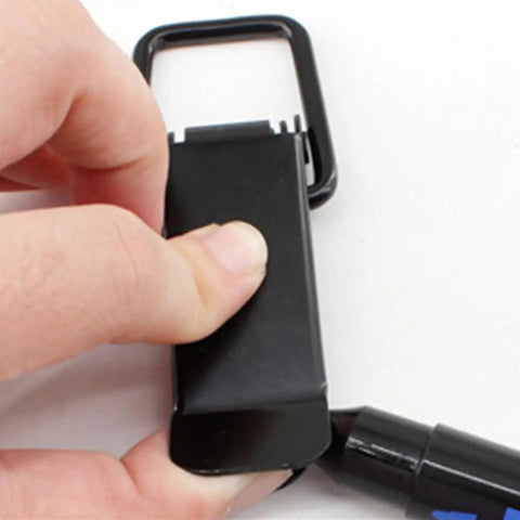 Close-up of hand pressing black spring loaded toggle latch from Spring Loaded Toggle Latch Set With Screws Heavy Duty Metal Box Latches For Cabinets, Doors, Windows, And Chests Easy Press To Close Quick Secure 4 Piece Kit.
