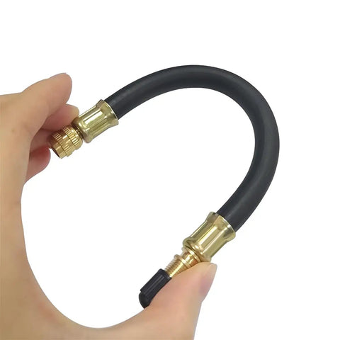 Four Pack Car Tire Valve Extensions 8.25 Inch Flexible Valve Stem Extenders in hand, showing copper core and rubber seal