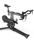 KICKR Bike Pro Indoor Trainer with Realistic Flywheel Resistance and Integrated Motor, side view with handlebars and seat visible