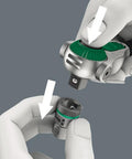 Hands using Zyklop 8000A Five In One Pro Grade One Fourth Inch Drive Ratchet With Swivel Head to attach socket