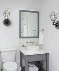 Dope Black Metal Wire Cage Ceiling Light With Pull Chain, Mini Modern Industrial Semi Flush Mount Lamp in a bathroom setup