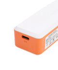 Mini UPS Battery Backup With 2600mAh Rechargeable Lithium Cell powers routers, orange and white design, sturdy power bank corner.