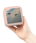 Hand holding Flying F15 And F16 Jet Aircraft Jewelry Travel Case Pink, Compact 4 x 4 x 2 Inch Travel Jewelry Organizer with soft plush lining.