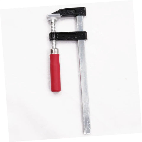 Heavy Duty Woodworking Clamps Set For Fastening Pliers And Quick Clamps Your Go To Tool For Industrial And Crafts Durable Steel Clips Simple To Use And Built To Last For Secure Woodworking Projects. Single metal clamp with red handle on white background.