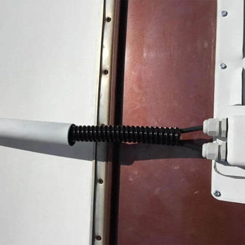 ABS Solar Double Cable Entry Gland Grommet Kit for All Cable Types from 2mm to 6mm installed on a wall for cable management