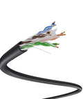 Close-up of black Cat6 Outdoor Ethernet Cable Direct Burial 23AWG Solid CCA UTP showing twisted pairs inside waterproof jacket.