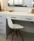 Dresser with Six Pack 5 Inch Center to Center Antique Brass Cabinet Pulls featuring knurled grip and circular end caps installed.