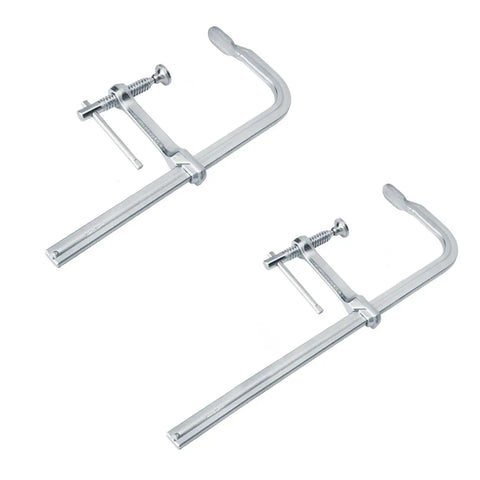 Two heavy duty F clamps with drop forged steel construction and adjustable rotating pads for welding and woodworking tasks.