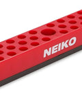 Red rectangular magnetic hex bit holder rack with 37 bit holes and strong magnetic base for quick access to bits on metal surfaces.